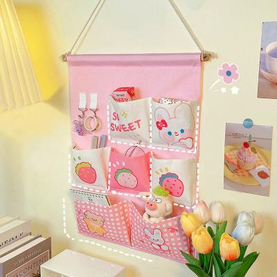 China 2021 Wall Mounted Dormitory Artifact Storage Bag Student Bag Amazon Cartoon Viable Cloth Storage Small Wall Mounted Bag On The Wall Behind for sale