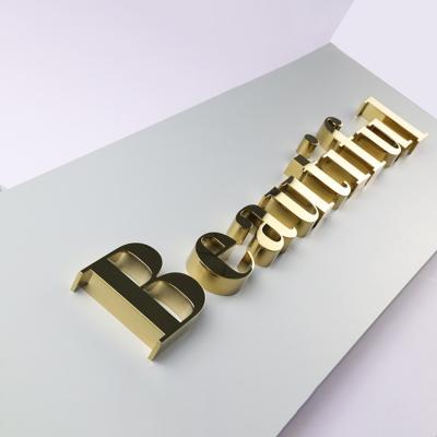 China Custom Stainless Steel Channel Letter Sign Energy Saving Gold Metal Letter For Business Decoration Logo Wall Letter for sale