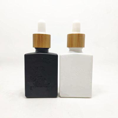 China Personal Care Essential Oil 20ml 30ml 50ml 100ml Rectangular Square Square Dropper Glass Bottle With Bottle Packaging for sale