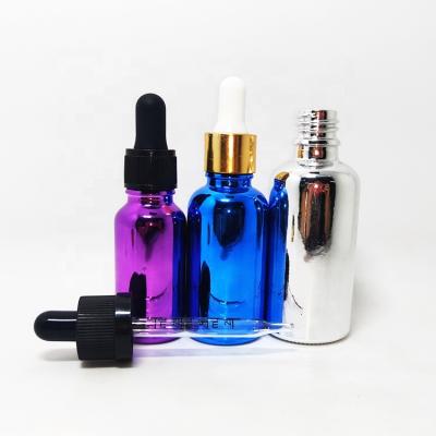 China Personal Care Glass Round Dispenser Hair Oil Boston Gold Cosmetic UV Dropper Bottles With NBR Bulb for sale