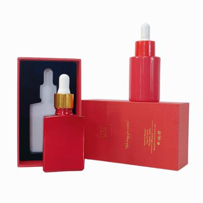 China Personal Care Skin Care Container Perfume Toner Essential Oil Square 30ml Rectangle Red Frosted Glass Dropper Bottle With Gift Packing Box for sale