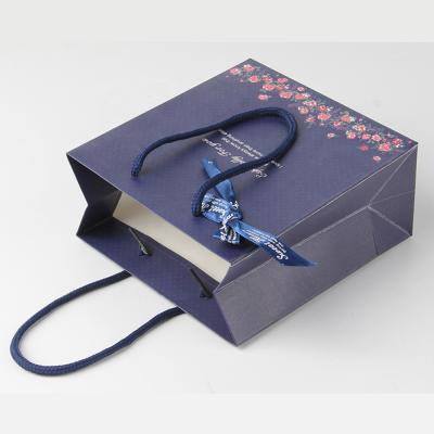 China Cost Production Recyclable Laminated Luxury Custom Ribbon Tied Small Blue Paper Gift Box Bag for sale