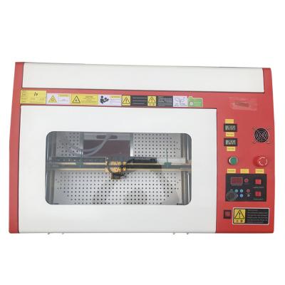 China Laser Engraving 3040 CO2 Laser Engraving Machine Mini Laser Stamp Engraving Machine for sale