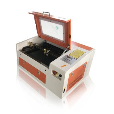 China Water Cooled 3040 4030 Laser Engraving Machine Laser Cutting Machine Laser Cutter For Rubber Stamp Acrylic for sale