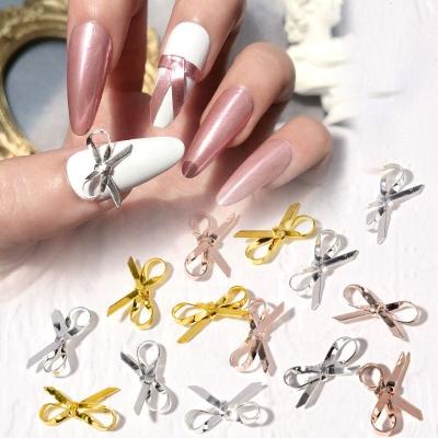 China Nail Art Decoration Paso Sico Hot Selling Popular Nail Ornaments Decorative 3 Colors Gold Silver Rose Ribbon Bow Metal Nail Art Decoration for sale