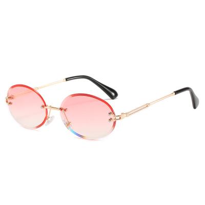 China Fashion Retro Small Sunglasses UV400 Gradient Oval Sunglasses 2021 Unisex Luxury Rimless Sunglasses for sale