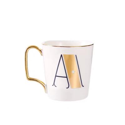 China Viable Creative Nordic Ceramic Luster Mug With Spoon Milk Cup Coffee Water Cup English Letter Mug 26 for sale