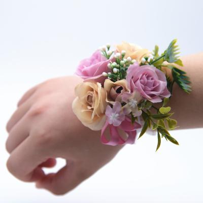 China Wedding Party Decor Wholesale Decorative Flower Wrist Artificial Bridal Flowers With Elastic Band Bridal Hand Flower for sale