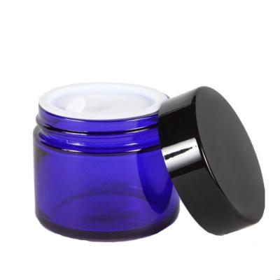 China Eco-freindly 50g 2oz Cobalt Blue Lotion Cream Scrub Round Glass Cosmetic Jars With Lid for sale