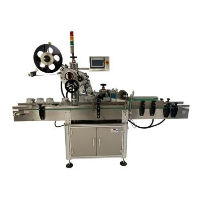 China Automatic Food Top Automatic Labeling Machine For Round And Flat Plastic Bottles for sale