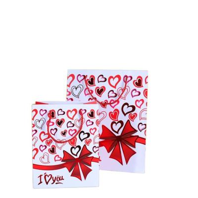 China 2022 KAIBO foil printing heart flower red flower paper bags handmade hot sale valentines day cheap gift bags boutique i love you for sale