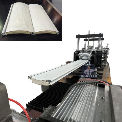 China PU sandwich shutter door roll forming machine for Turkey Galvanized steel or PPGI or Aluminium for sale