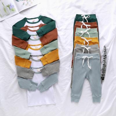 China Raglan sleeve o neck baby clothing set anti-shrink pajamas set organic cotton baby pajamas for sale