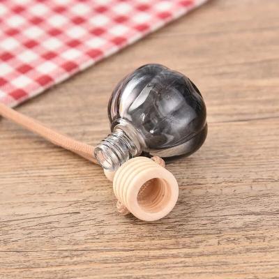 China Personal Care 10ml Car Diffuser Empty Perfume Bottle With Wooden Cap Hanging Rope Tied For Car Air Freshener for sale