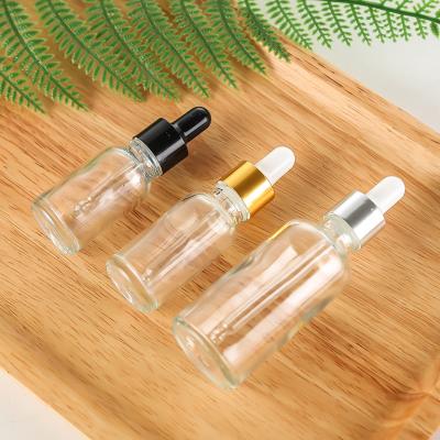 China Wholesale Clear Cosmetics Glass Cosmetic Bottle With Dropper Essential Oil Bottle for sale