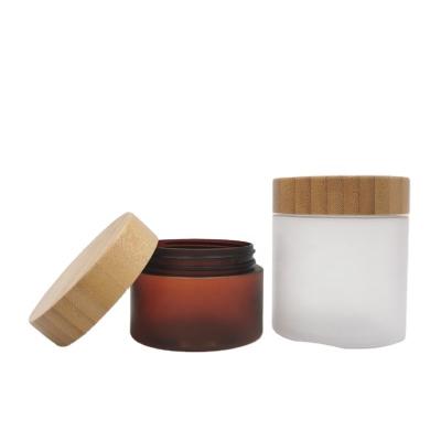 China 150ml 250ml Skin Care Clay Mask Cream Jar Eco-friendly Empty Facial Bamboo Wooden Lid PET Cream Jars Transparent Frosted Plastic Jar for sale