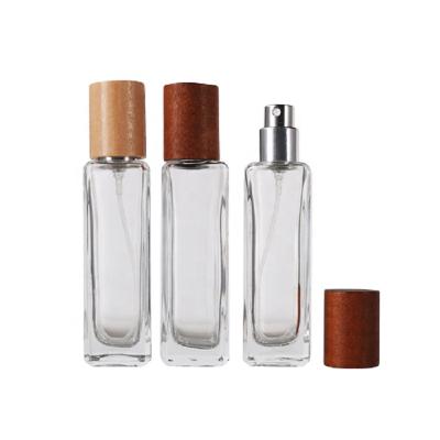 China 30ml Perfume Bottle Square Atomizer Perfume Bottle Bamboo Wood Lid Cosmetic Packaging Empty Perfume Bottle With Bayonet Cap Finish for sale