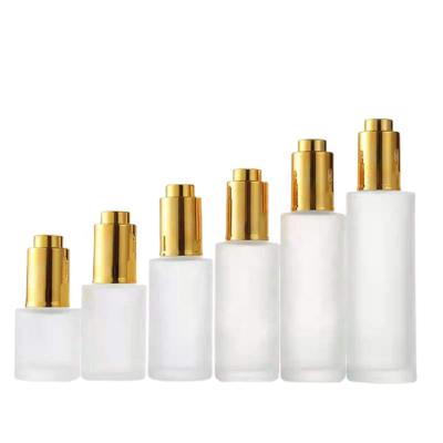 China 20~100ml Cosmetic Frosted Dropper Bottle Push Button Serum Dropper Bottle Shoulder Press Pump Gold Cap Flat Glass Essential Oil Bottles for sale