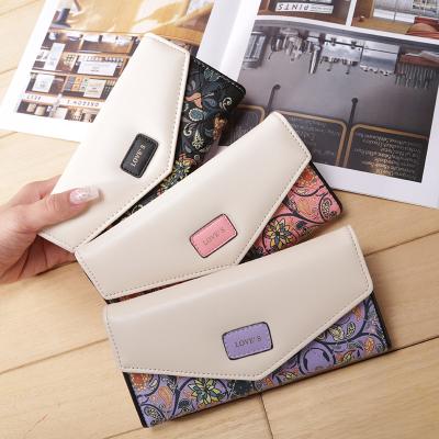 China Waterproof Korean version of the flower ring handbag color envelope buckle small purse lady broken bag for sale