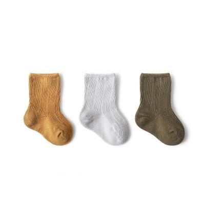 China New style QUICK DRY combed cotton baby socks for fall and winter, solid color children's socks, newborn socks for sale