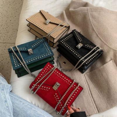 China 2021 high quality trend fashion rivet handbags cross - body bag women's purses luxury purses and handbags for women for sale