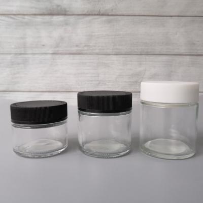 China Child Proof Flower Jar 60ml 90ml 120ml Child Proof Jars Concentrate Dry Herb Flower Sm Glass Container Child Proof Cap White Cap Or Black Cap for sale