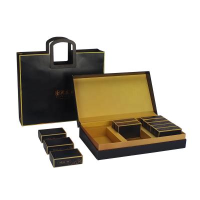 China Recyclable Tea Packaging Custom Clamshell Gift Boxes Black And Gold Packaging Boxes for sale