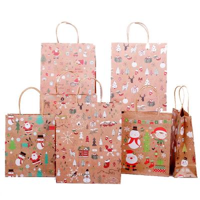 China Eco-friendly Christmas Gift Bags Friendly Thick Christmas Kraft Paper Candy Bags With Christmas Prints For Christmas Party for sale