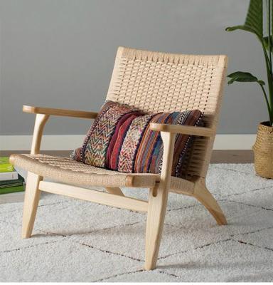 China Low Black Natural Rattan Cane Wicker Lounge Chair Leisure Natural Chair Living Room Vintage Wholesale Price Rattan for sale