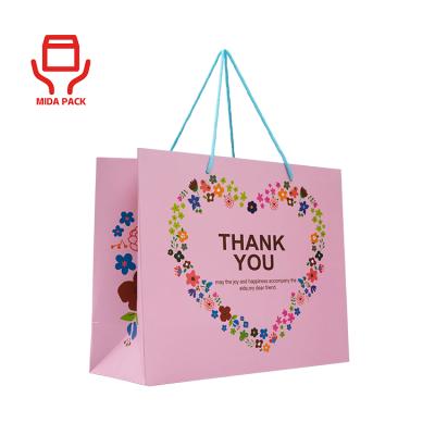 China Wholesale Recyclable Luxury Branded Retail White Rose Kraft Paper Shopping Bag With Custom Your Own Logo Rope Handle for sale