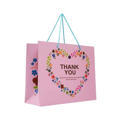 China Recyclable Bags Paper With Rope Handles Custom Designs Paper Bags Matte Black Coated Paper Christmas Bag for sale