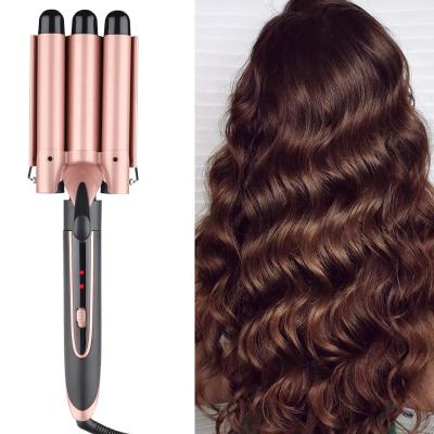 China Professional Best Against Heat Protection Electric Comb Auto Turn LCD Ceramic Hair Curler Curling Iron 3 Barrel Ceramic Wand Hair Iron Hot Curling Tool for sale