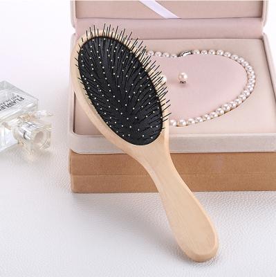 China OEM ODM Nondisposable High Quality Nylon Bristle Scalp Massager Oval Long Shape Wooden Paddle Hair Brush for sale