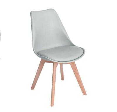 China Modern Nordic Tulip Design PU Pad Lounge chair Dining chair wood legs for sale