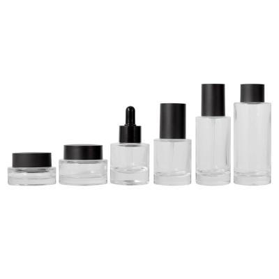 China Eco-friendly Recyclable High Quality OEM 30ml Frosted Clear Glass Bottle Set 100ml Serum Thick Bottom Cosmetic Dropper Bottle With Black Dropper for sale