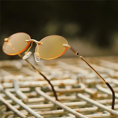 China New Fashion Rectangle Super Frame Women Oval Rimless Sunglasses 2020 Trendy Oval Sun Glasses UV Protection Shades 400 Small For Lady for sale