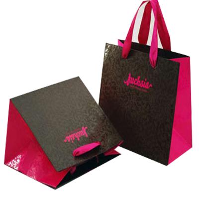 China Recyclable Custom Unique Foldable Shopping Paper Gift Bags With Handles for sale