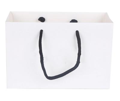 China Recyclable White Flat Bottom Kraft Paper Shopping Bag With Handle for sale