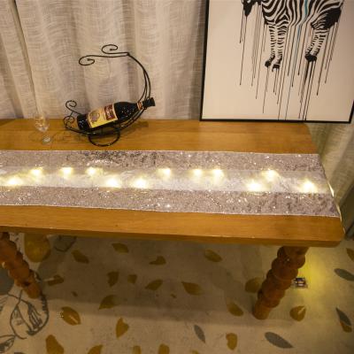 China Classic Shiny Rectangle Glitter Table Cloth Glitter Dining Table Mat With LED Light Up Ribbon Table Runner for sale