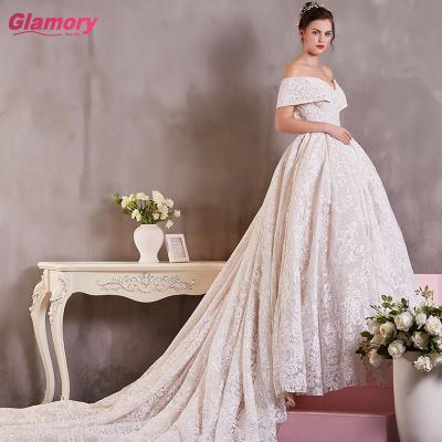 China Newest Breathable Breast Wedding Dress With Luxury Train Gorgeous Lace Long Off The Shoulder Wedding Dress for sale