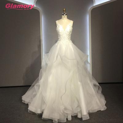 China Breathable White Spaghetti Strap V-Neck Beading Wedding Dress Lace Ruffles Tulle Skirt Wedding Dress for sale