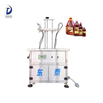 China Semi-automatic food coconut oil bottle filling machine palm oil filling machine for sale