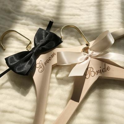 China Fashionable Engraved Wooden Dress Hanger Wedding for sale