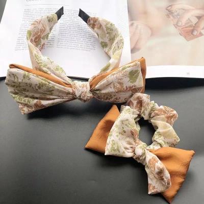 China Designer New Retro Fashion Big Bow Superb Hair Band Female Savage Gorgeous Luxury Brand Go Out Cute Headband Wide-sided Floral Hair Ba for sale