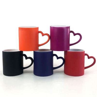 China 11oz stocked frosted magic mug with heart shaped handle for sale