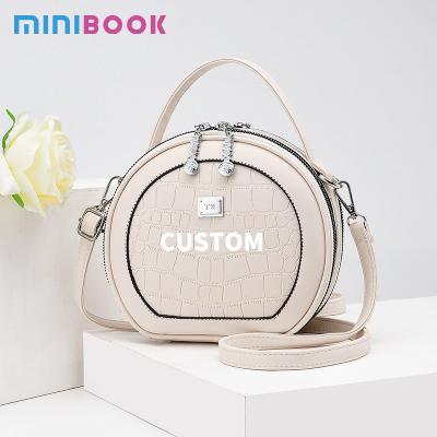 China All Seasons Crocodile Pattern Fashion Round PU Leather Women's Designer Handbag with Lock for sale