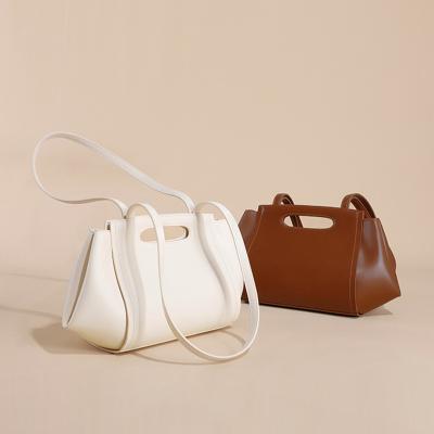 China Low MOQ Mix Models Cowhide Versatile Armpit Bag Niche Design Shoulder Bag for Women for sale