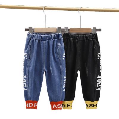 China Anti-Wrinkle Toddler Baby Boy Jeans Pants Hot Selling Casual Letter Printed 0-5 Years Old Boy Denim Pants For Falling Harem Jeans for sale