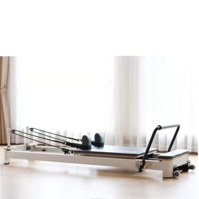 China 2021 white gym center fitness yoga exercise aluminum alloy pilates reformer bed for sale