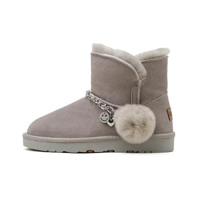 China Fashion Trend Drop Shipping 2021 Classic LOGO Hairball Dangle Chain Leather Snow Boots Short New Mini Winter Cowhide Women's Boots for sale